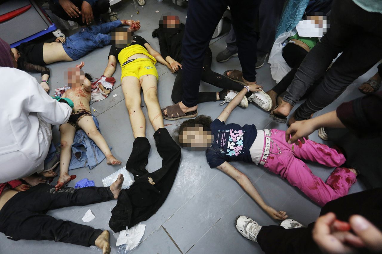 Injured Palestinian children are brought to the al-Aqsa Martyrs Hospital following an attack at Maghazi refugee camp in Deir al-Balah, Gaza, on April 16. CNN has added blur to this image to protect identities.