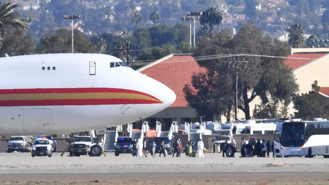 Passengers on a charter flight from Wuhan, China, arrive in Riverside, California, on January 29.