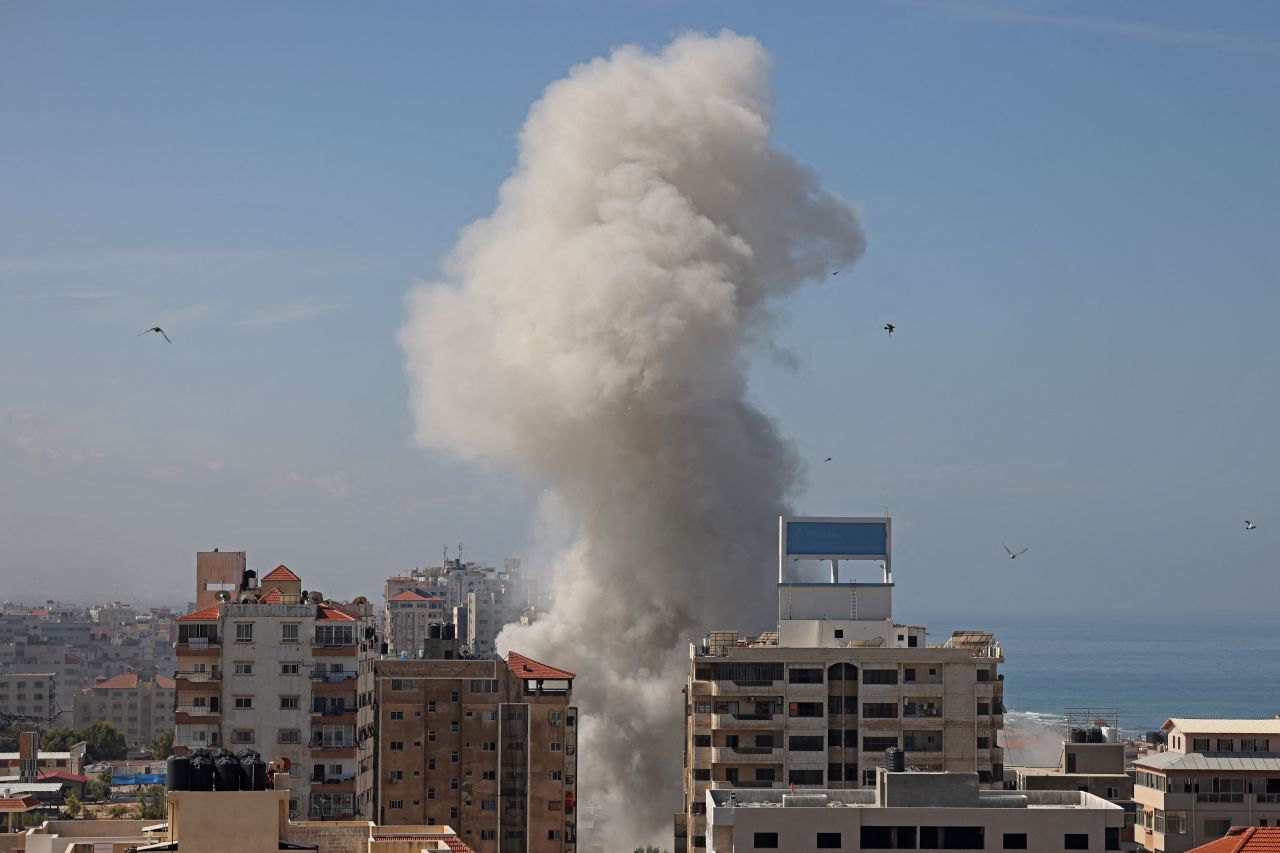 Smoke billows from a residential building following an Israeli airstrike in Gaza City on October 7, 2023.