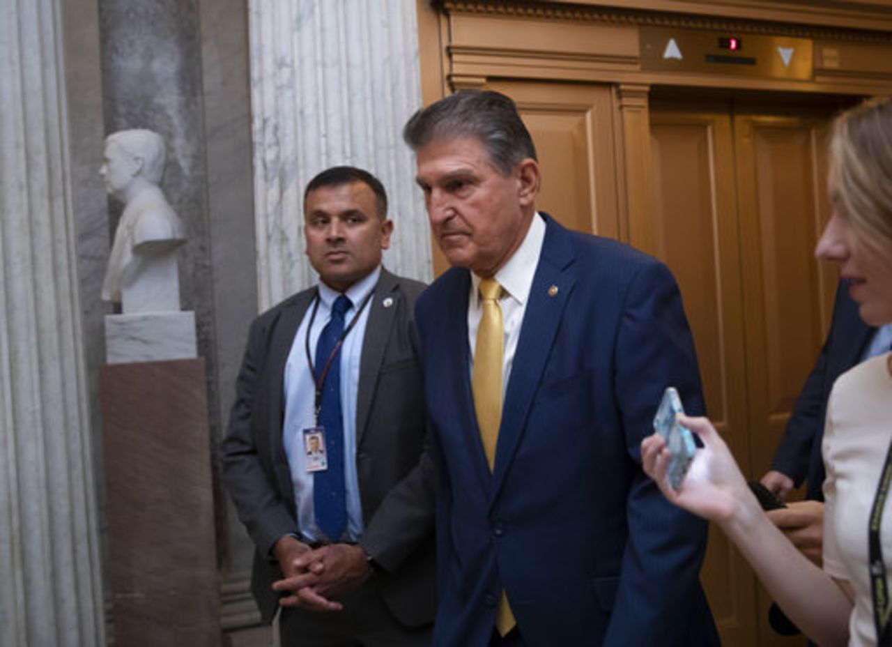 Sen. Joe Manchin, D-W.Va., arrives at the chamber for a procedural vote to advance the confirmation of Supreme Court nominee Brett Kavanaugh, at the Capitol in Washington, on Oct. 5, 2018. 