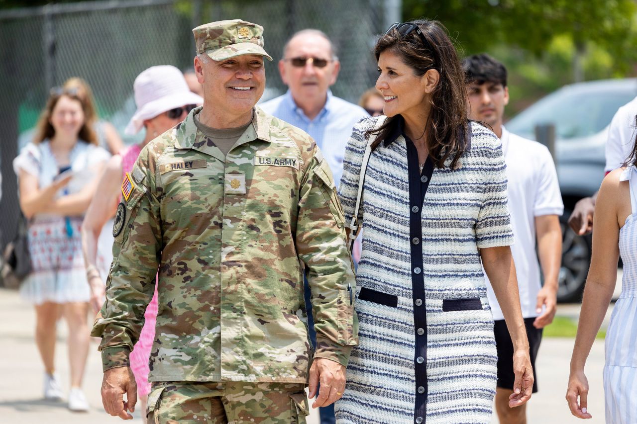 In this June 2023 photo, Republican presidential candidate Nikki Haley walks with her husband Maj. Michael Haley following a deployment ceremony for his unit of the South Carolina National Guard on at Johnson Hagood Stadium in Charleston, South Carolina.
