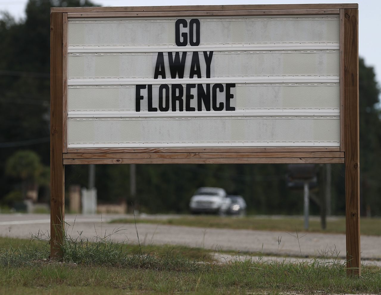 A sign reads 'Go Away Florence' in Myrtle Beach, South Carolina.