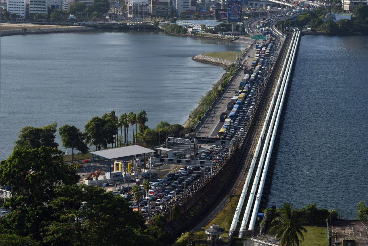 A line of cars waiting to enter Singapore from southern Malaysia forms at the Woodlands checkpoint on March 17.