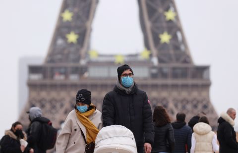 People walk past the Trocadero place near the Eiffel Tower in Paris, France, Dec. 29, 2021. France reported on Wednesday 208,099 new confirmed Covid-19 cases detected in the past 24 hours, a new daily record since the outbreak of the pandemic in France. 