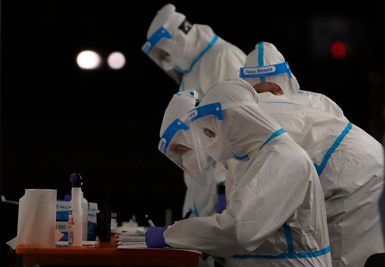Medical workers at a triage check point that was set up to ease the pressure on hospital emergency wards, following a surge in Covid-19 case numbers, in Milan, on Tuesday, November 10.