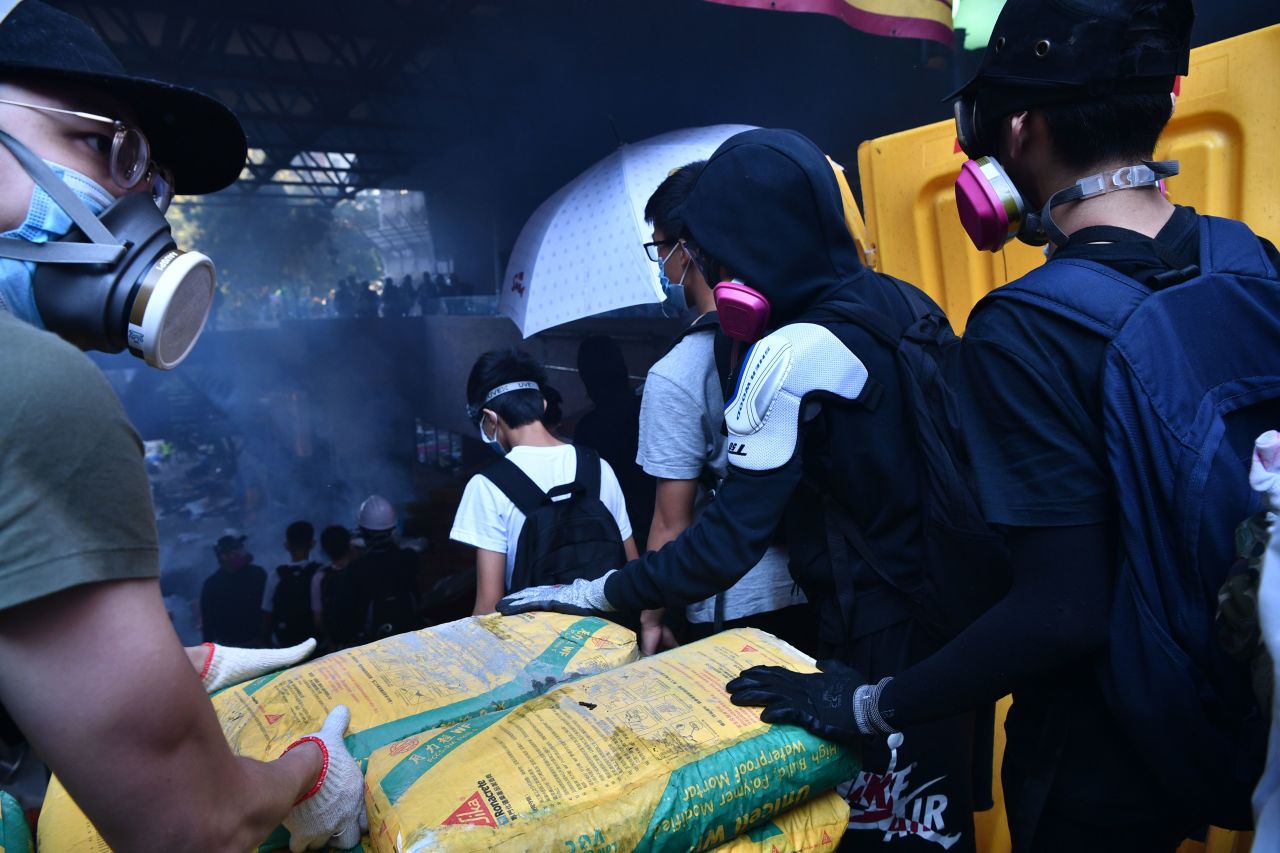Protesters stream down onto the street below to find safe passage from campus, in Hung Hom district of Hong Kong on November 18.