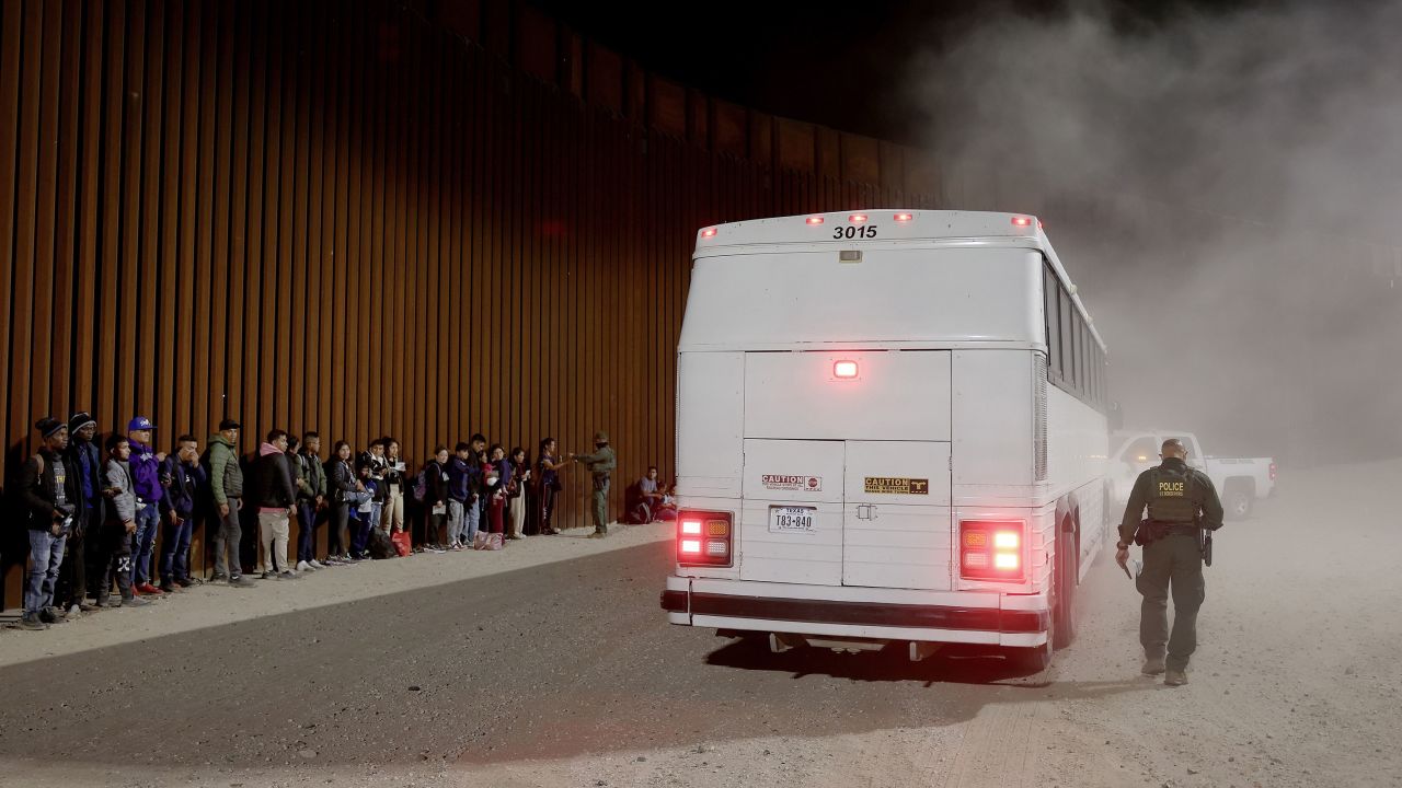 Immigrants seeking asylum in the United States are processed by Border Patrol agents after crossing into Arizona from Mexico on May 11.