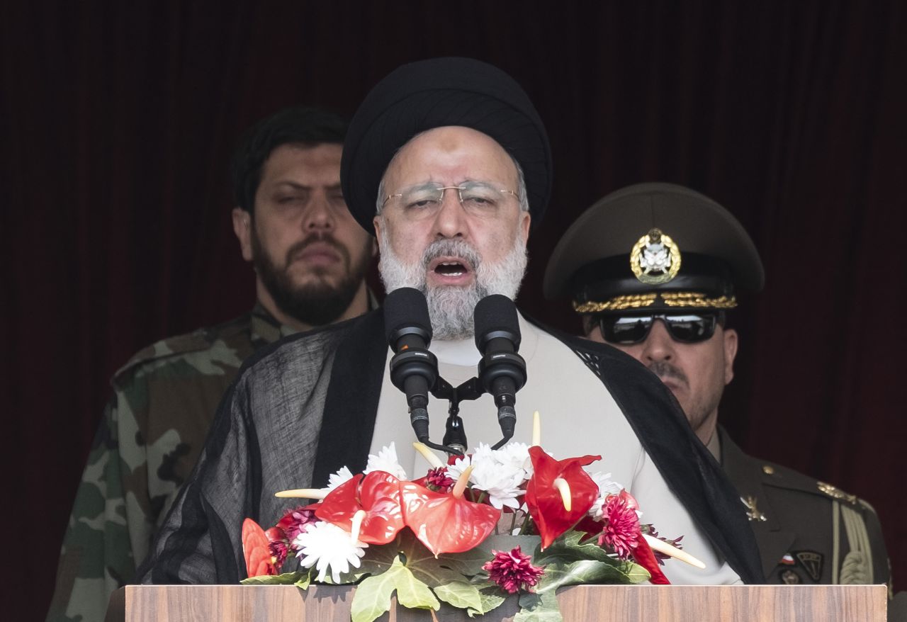 Iranian President Ebrahim Raisi (C) addresses attendees at a military parade marking Iran's Army Day anniversary at an Army military base in Tehran, Iran, on April 17.