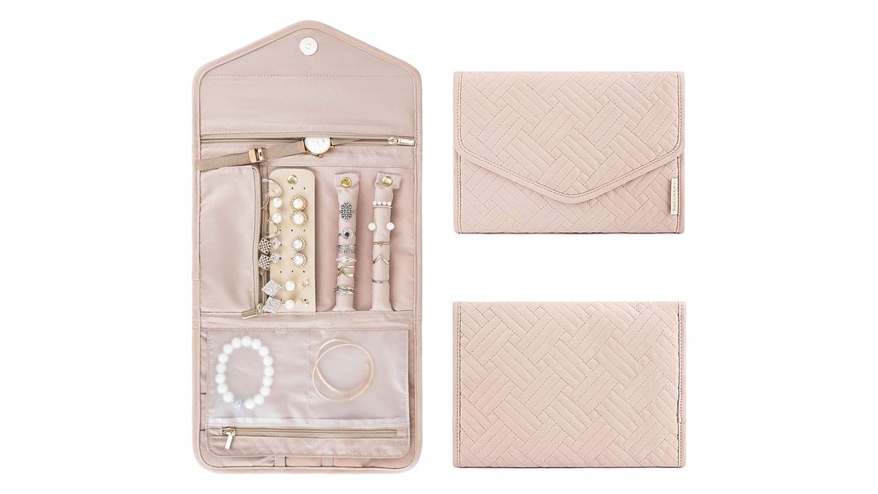 A photo of an open Bagsmart Travel Jewelry Organizer Roll