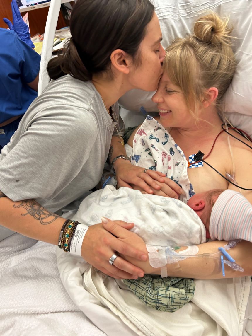 Simone and Sophie Bain-Tohl holding their son, Jackson.