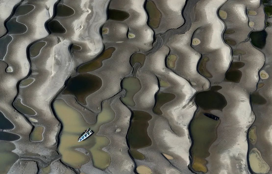 Stranded ships on the sand banks exposed due to drought on the Solimoes River, one of the largest tributaries of the Amazon River, near Manacapuru, state of Amazonas, Brazil, September 30, 2024.