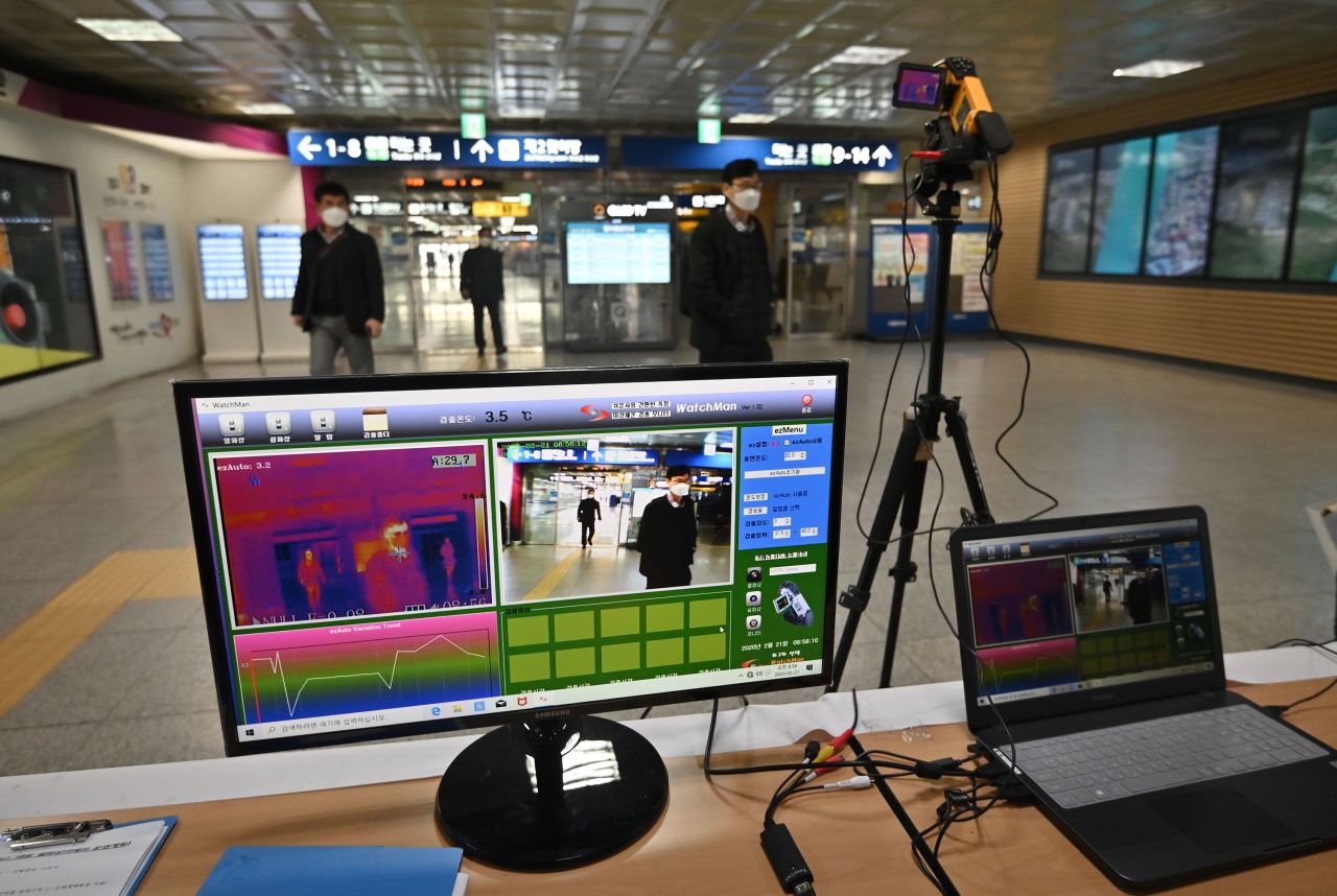 A thermal camera system monitors the body heat of passengers at a railway station in Daegu.