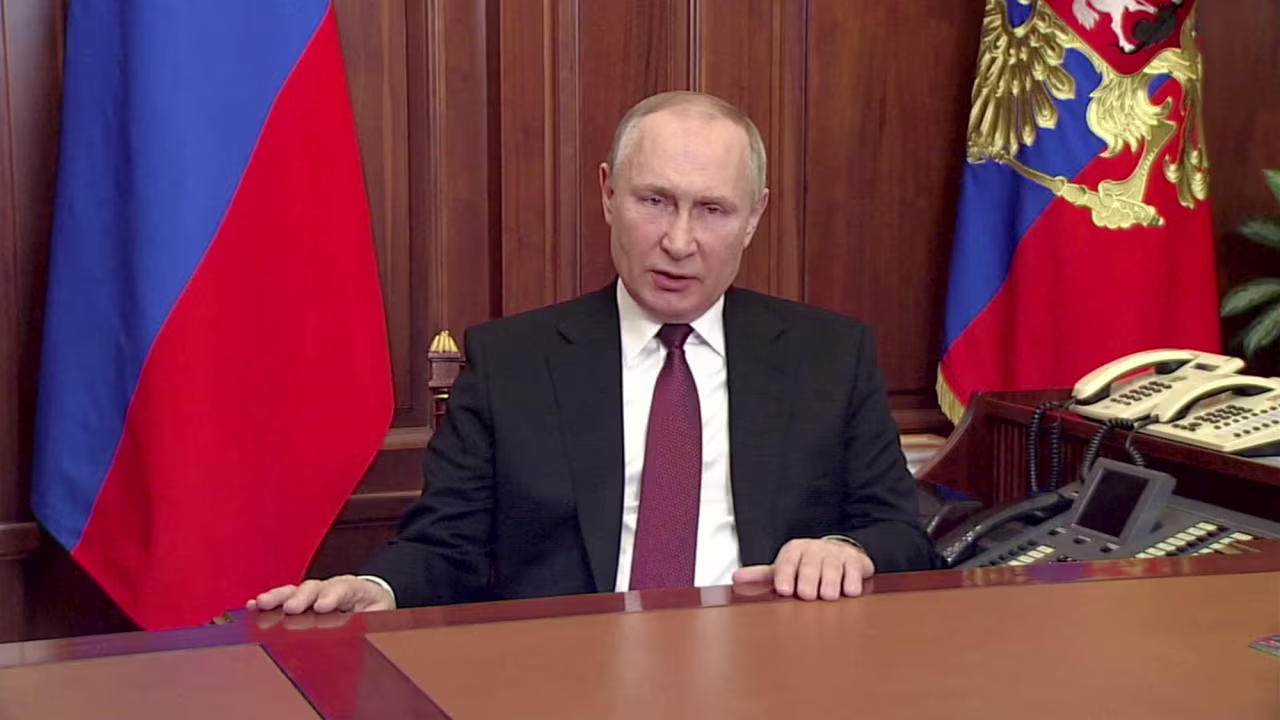 Russian President Vladimir Putin delivers a video address announcing the start of the military operation in eastern Ukraine, in Moscow, in a still image taken from video footage released February 24, 2022.