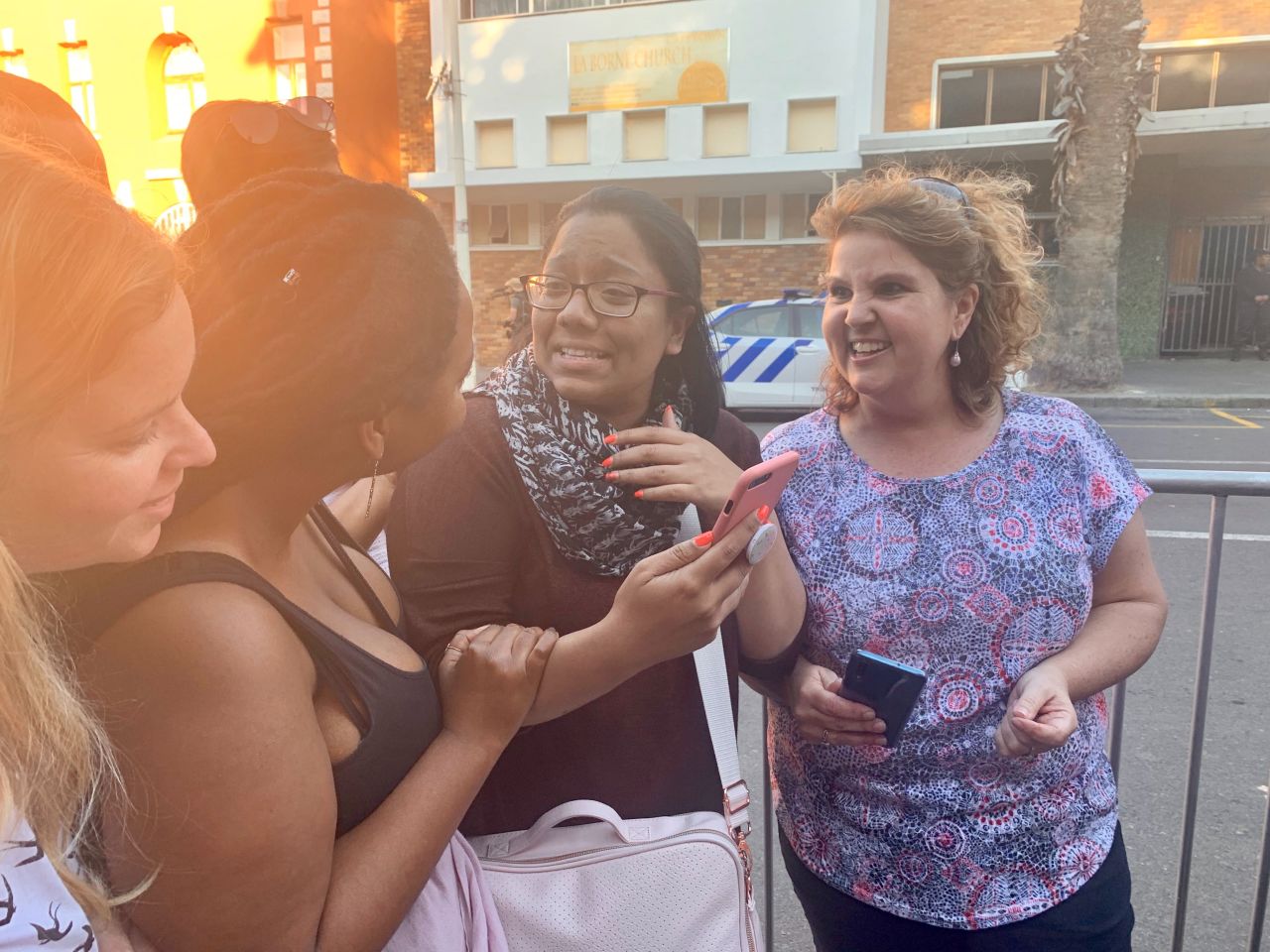 Tarryn Josephs, center, chats excitedly about her meeting with Meghan, Duchess of Sussex, in Cape Town