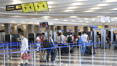 Travelers stand in line for a security check at the Sharm El Sheikh International Airport in June.