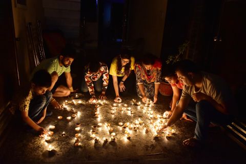 People light candles during the vigil in Amritsar, India.