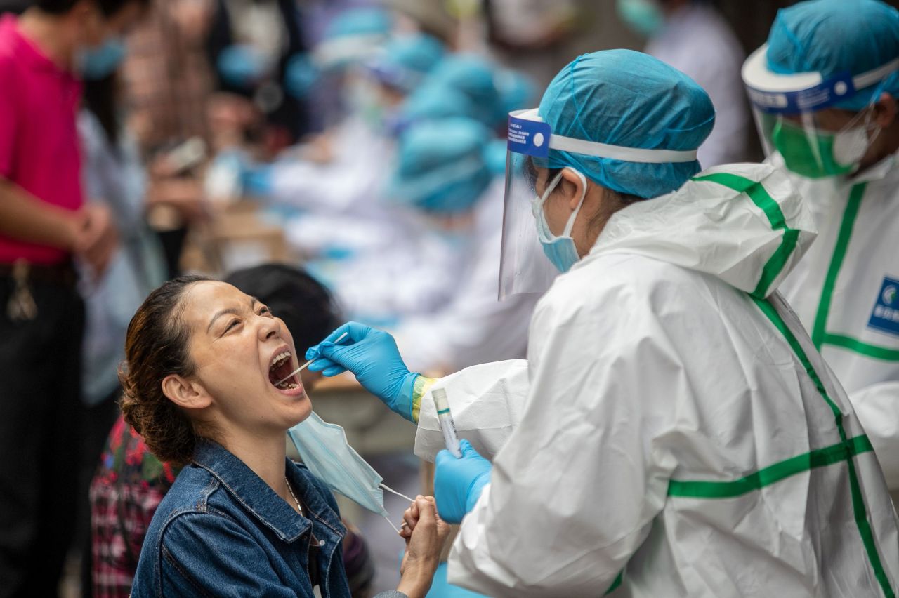 A medical worker takes a coronavirus test swab from a resident in Wuhan, China, on May 15.