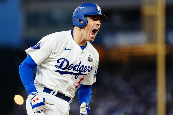 Dodgers first baseman Freddie Freeman celebrates after hitting a solo home run in the third inning. The run put the Dodgers up 4-1.