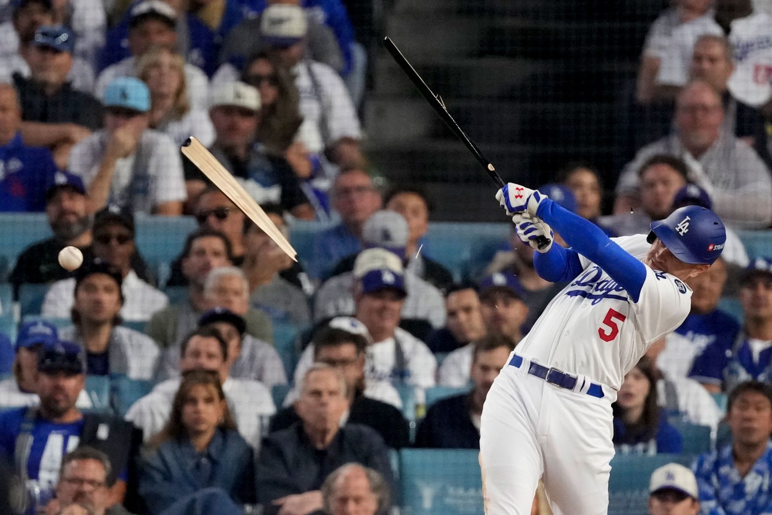 Freeman breaks his bat as he grounds out in the fourth inning of Game 1.