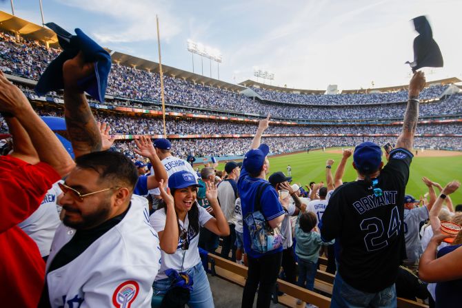 Dodgers fans celebrate a home run hit by Tommy Edman in the second inning of Game 2.