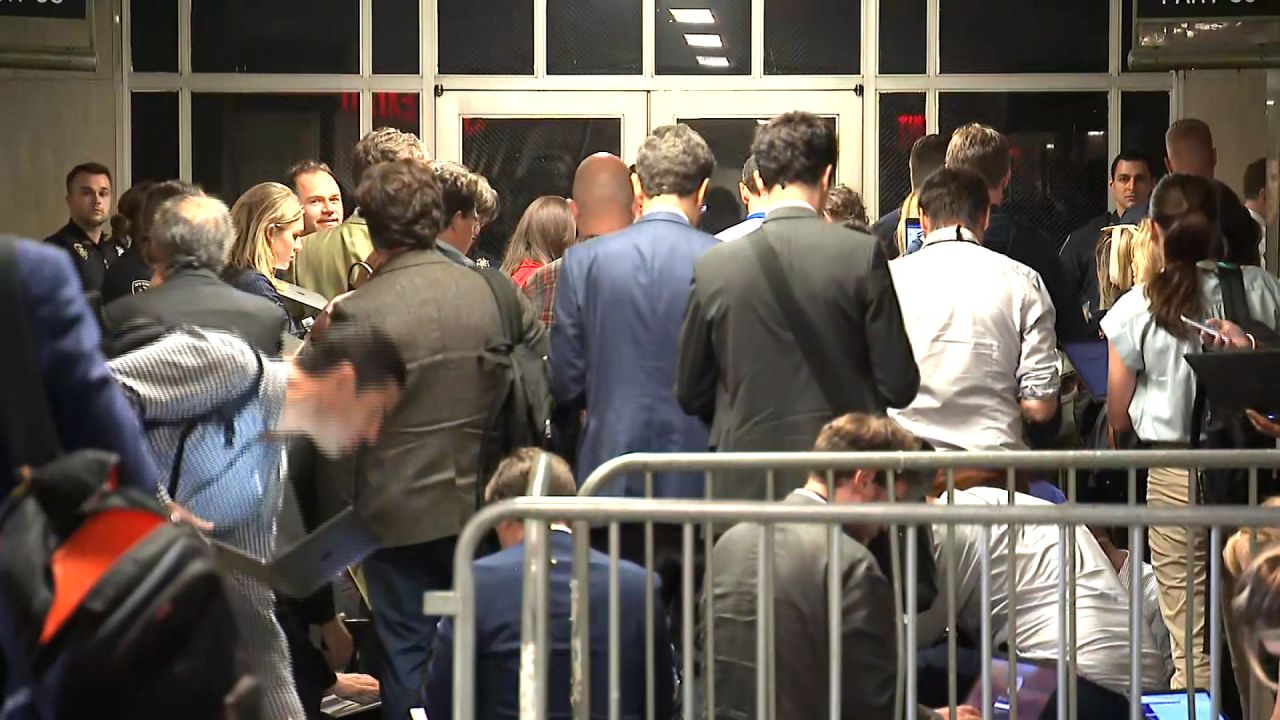 Reporters wait in the hallway after Judge Juan Merchan ejected reporters and others from the courtroom and admonished the second witness called by the defense in Trump’s hush money trial.