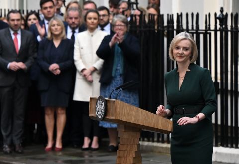 Britain's outgoing Prime Minister Liz Truss steps back from the podium after delivering her final speech outside 10 Downing Street in central London, Tuesday, before heading to Buckingham Palace to give her resignation to King Charles III.