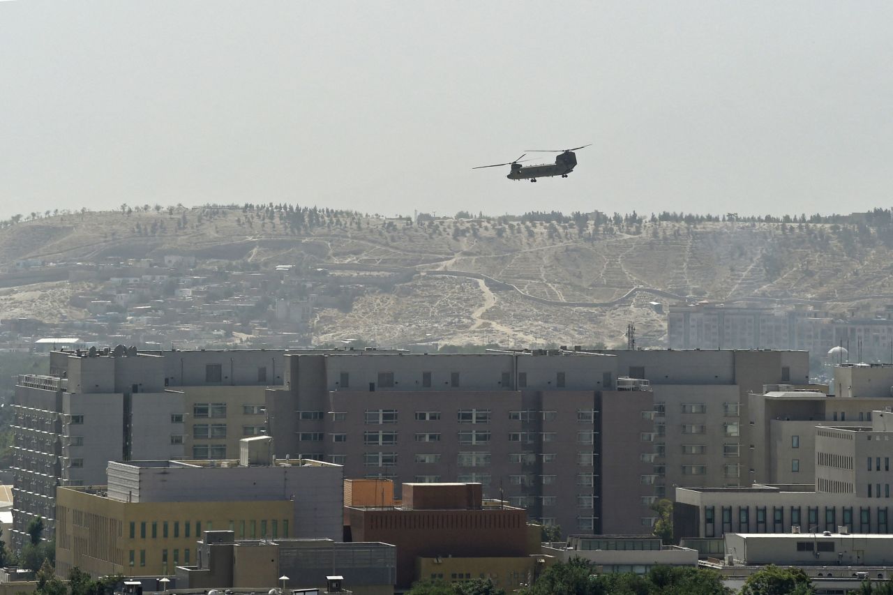 A US military helicopter is pictured flying above the US embassy in Kabul on Sunday.