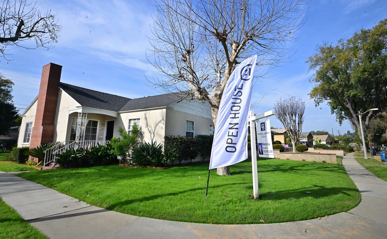 An "Open House" flag is seen in front of a home for sale in Alhambra, California, on January 18.