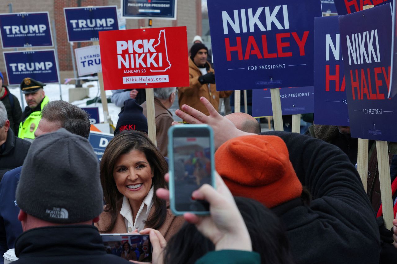 Nikki Haley talks to reporters outside a polling place in Hampton, New Hampshire, on Tuesday.