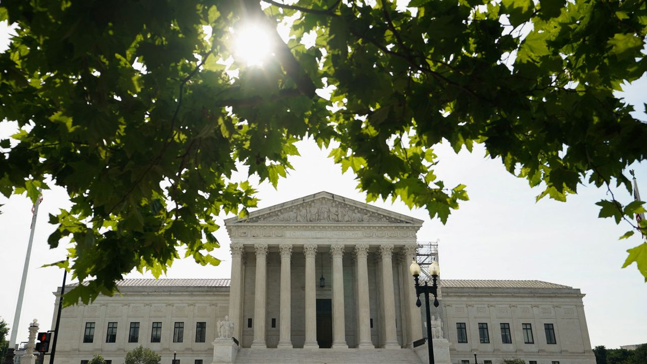 People line up to get into the US Supreme Court on the day where decisions ares expected to be handed down, in Washington, DC, on June 26. 