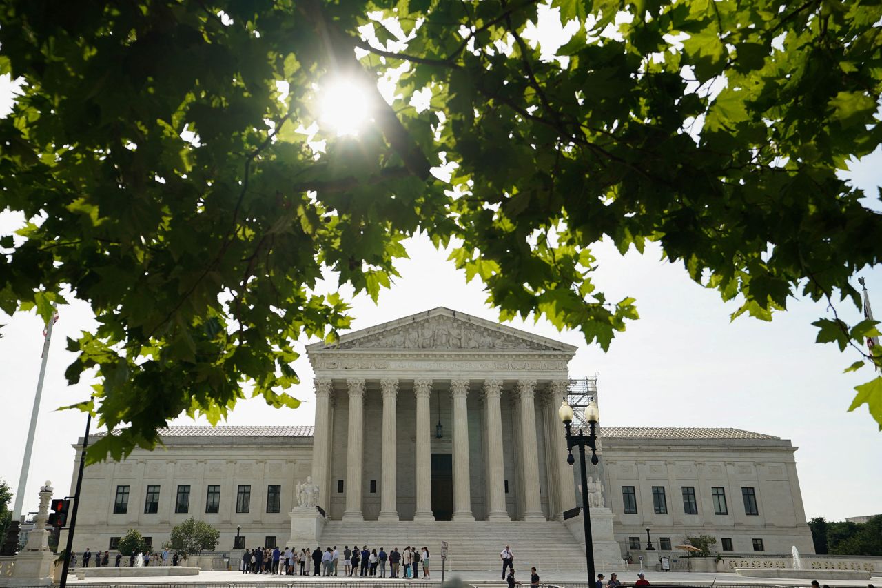 People line up to get into the US Supreme Court on the day where decisions ares expected to be handed down, in Washington, DC, on June 26. 