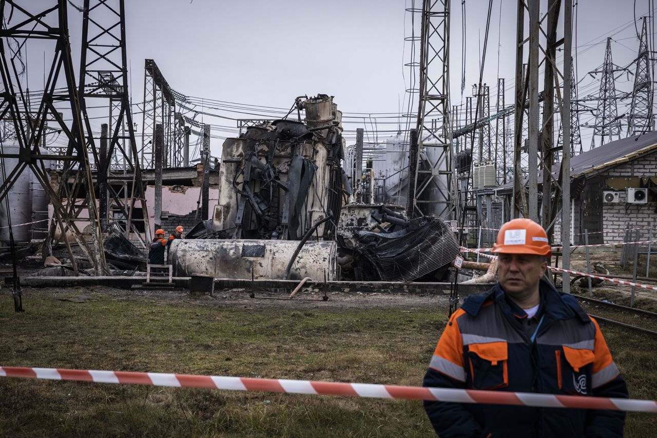 Workers dismantle an autotransformer, which stands completely destroyed after the Ukrenergo high voltage power substation was directly hit by a missile strike, in central Ukraine on November 10.