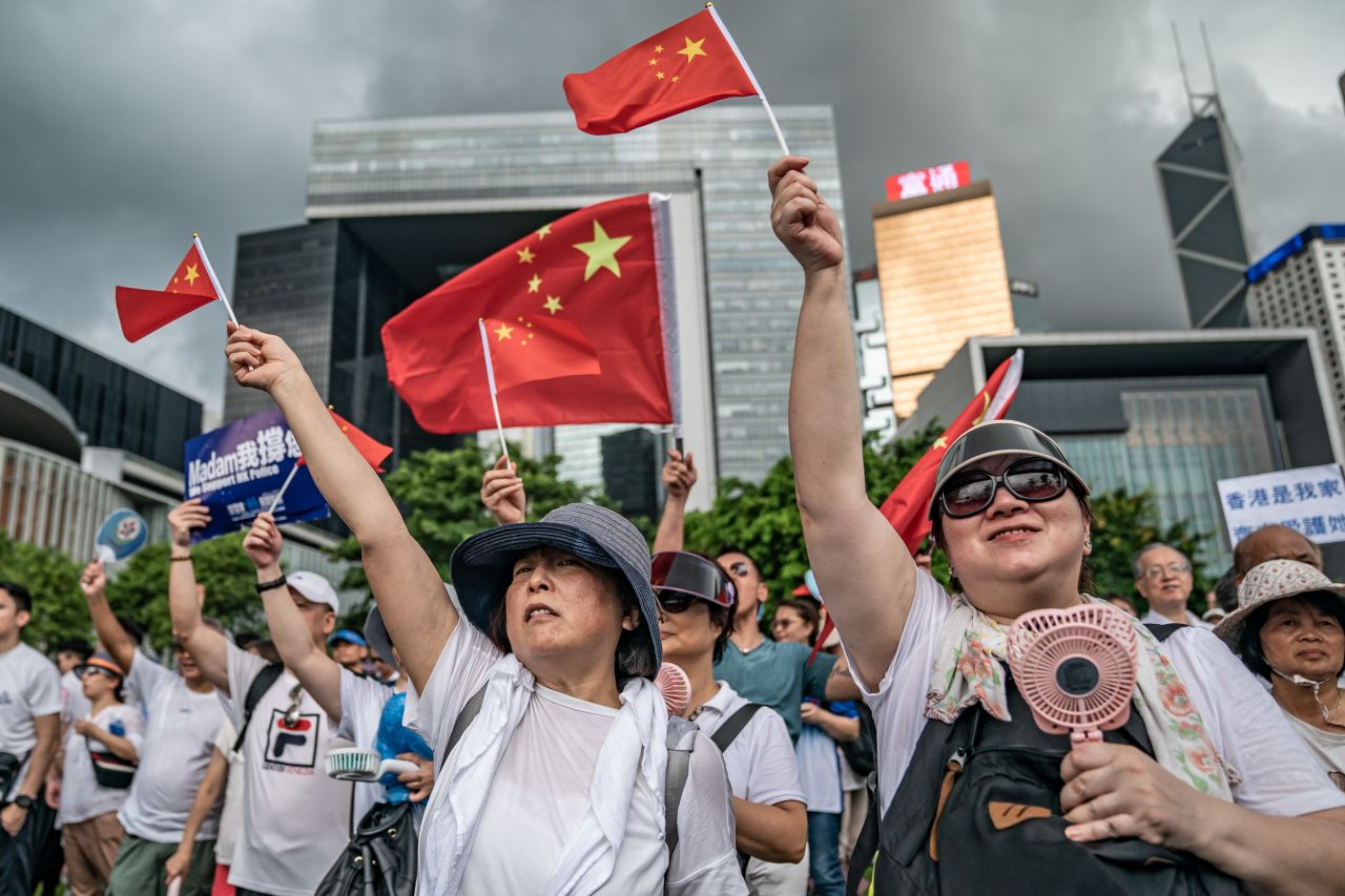 Demonstrators wave Chinese flags during a pro-police rally in Hong Kong on June 30, 2019.