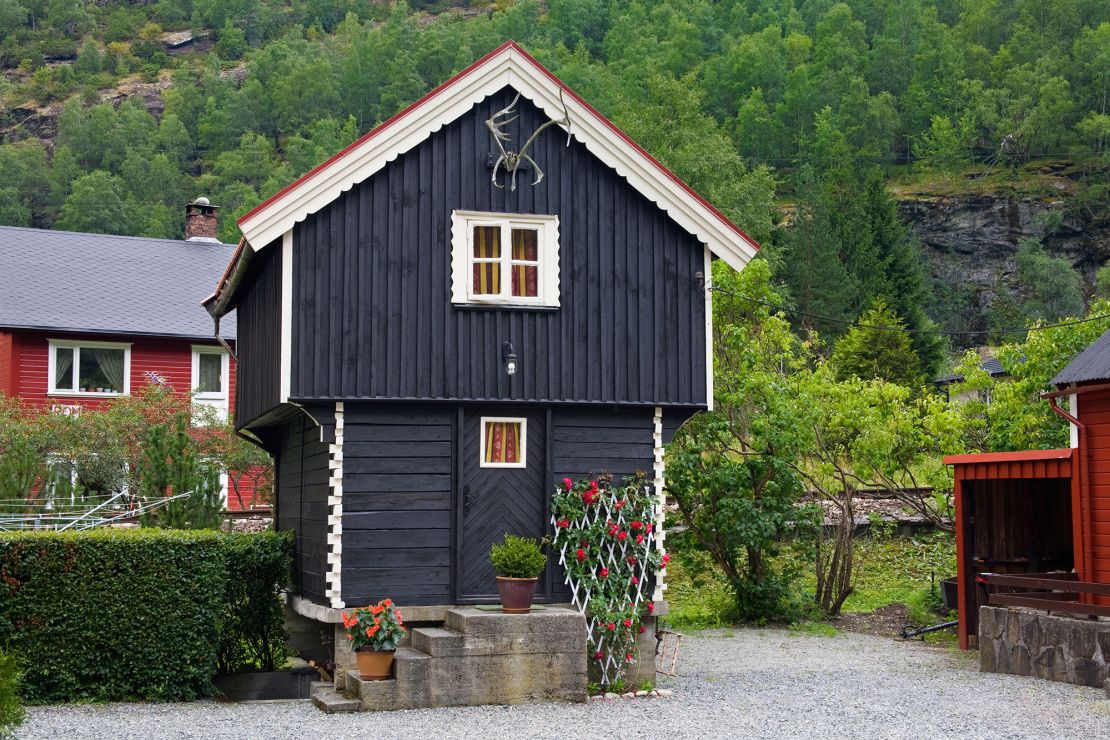 Across Scandinavia, houses are often painted black like this one in Flam, Norway. One reason is that black surfaces can absorb heat more than other colors.