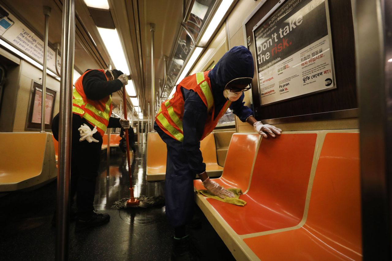 Workers clean a train car as the New York City subway system is closed for nightly cleaning on May 7.