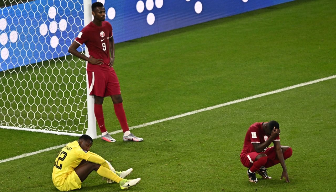 Qatari players react at the end of their loss against Senegal on Friday.