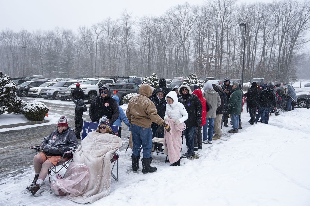 Supporters of Republican presidential candidate and former President Donald Trump wait in line during a winter snowstorm to enter a campaign event in Atkinson, N.H., on Tuesday, Jan. 16.