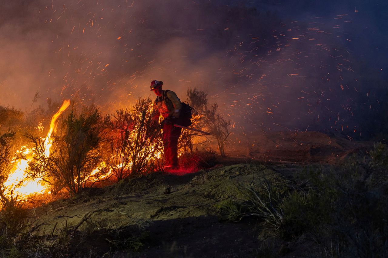 A firefighter battles the Sites fire near Lodoga, California, on June 17.