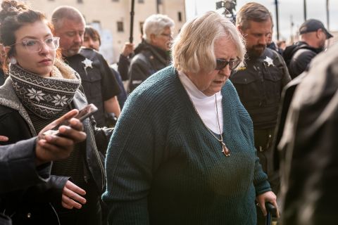 Susan Hughes, center, Anthony Huber's great aunt, and Huber's girlfriend Hannah Gittings, left, leave the Kenosha County Courthouse after hearing a not guilty verdict in the Rittenhouse trial on November 19 in Kenosha, Wisconsin. 