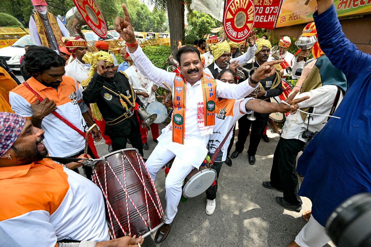 Supporters of Bharatiya Janata Party (BJP) celebrate vote counting results for India's general election outside the BJP headquarter in New Delhi on June 4.