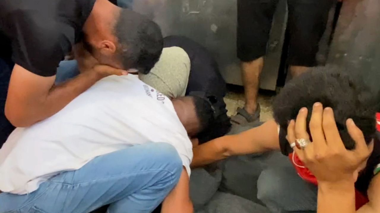 In a still picture taken from a video, family members of those killed by an Israeli airstrike mourn in Deir-al-Balah, Gaza, on June 8.