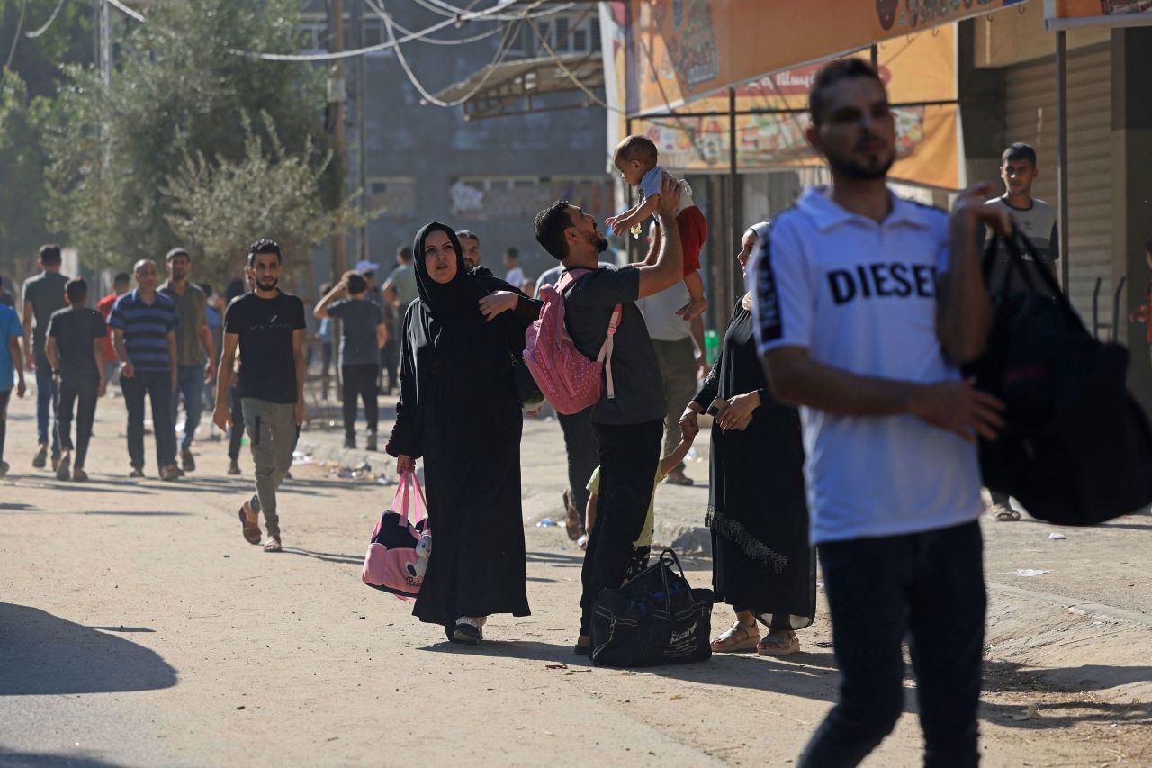 Residents in the Gaza Strip flee their homes to move away from the border with Israel after barrages of rockets were fired from the coastal enclave into Israel on October 7, 2023.