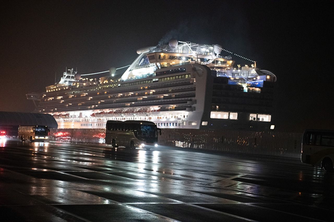 Buses carry American citizens from the quarantined Diamond Princess cruise ship at Daikoku Pier to be repatriated to the United States, on Monday, February 17 in Yokohama, Japan. 