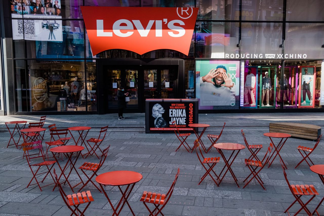 Empty tables are seen in Times Square on Monday, March 16.