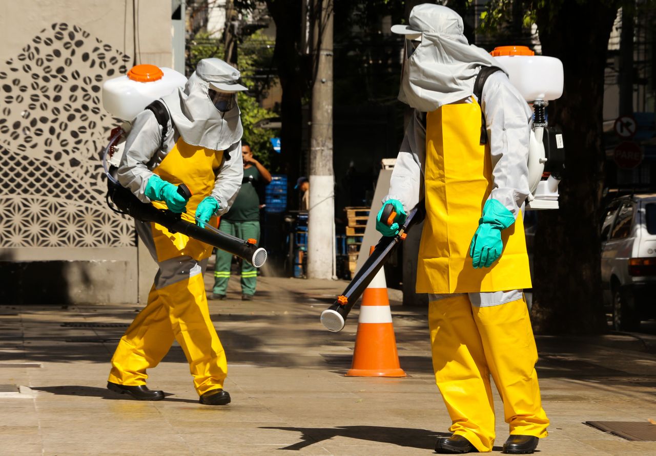 Members of a cleaning crew disinfect a neighborhood in Niteroi, Brazil on March 23.