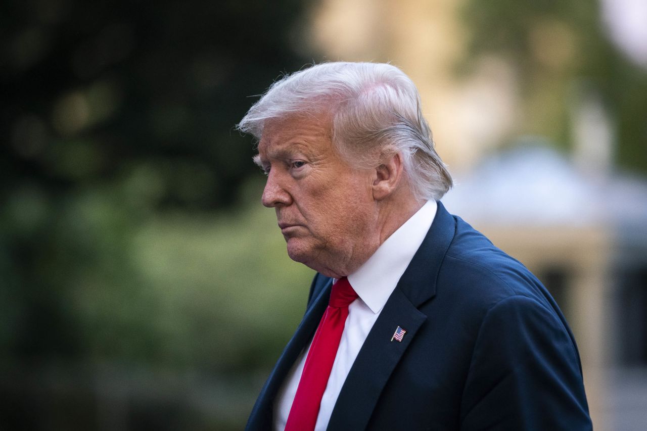 President Donald Trump walks to the White House residence after exiting Marine One on June 25, in Washington, DC.