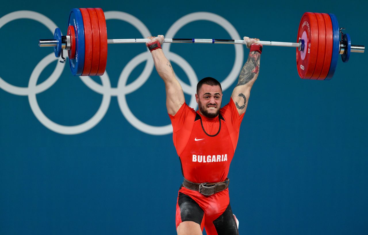 Karlos May Nasar of Bulgaria performs a clean and jerk, setting a new world record during the men's 89kg weightlifting on Friday.