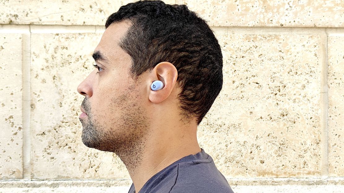 The author is wearing a Beats Solo Buds earbud in his left ear.