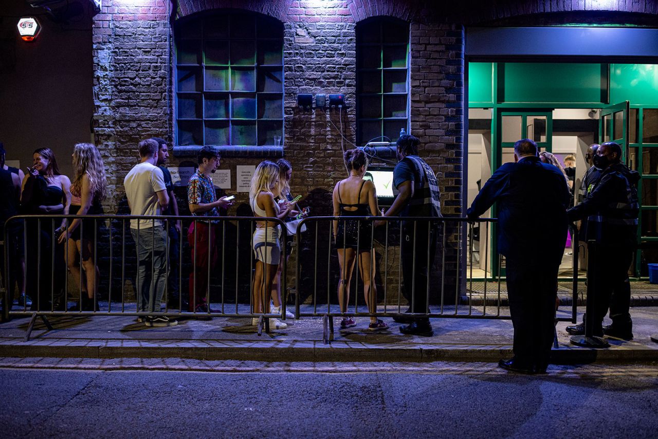 People wait in line to get into a nightclub in London, England, on July 19.