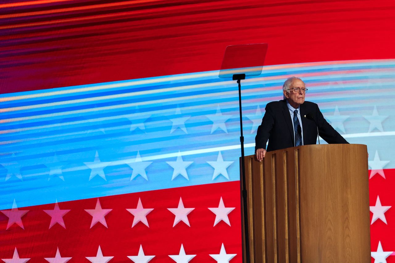 Sen. Bernie Sanders stands onstage during Day 2 of the Democratic National Convention in Chicago.